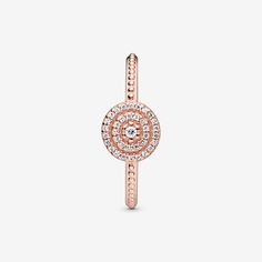 A style you'll reach for time and time again, this timeless Elegant Sparkle Ring is centred with a single stone surrounded by two rings of cubic zirconia that sparkle as they catch the light. Equally beautiful worn alone or as part of a personal ring stack, the polished 14k rose gold-plated ring is further detailed with beading on the band. Try layering similar styles in contrasting metals. - Pandora Elegant Sparkle Ring - 14k Rose gold-plated unique metal blend / Cubic Zirconia / Clear - Sz. 4.5 Fine Jewelry Rose Gold Rings With Sparkling Stones, Sparkling Rose Gold Fine Jewelry Rings, Rose Gold Rings With Sparkling Stones And Cubic Zirconia, Timeless Rose Gold Jewelry With Center Stone, Sparkling Rose Gold Ring, Rose Gold Plated Ring, Two Rings, Ring Stack, Sparkling Rings