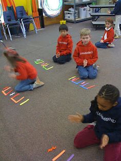 children are playing with magnets on the floor