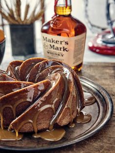 a bundt cake with caramel drizzled on it sitting on a plate