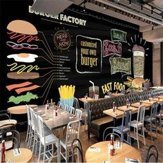 the interior of a fast food restaurant with large chalkboard menus on the wall