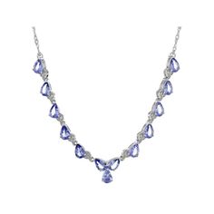 4.68ctw Pear Tanzanite And 0.18ctw Round White Zircon Rhodium Over Sterling Silver Necklace. Measures Approximately 0.36"W. Pear-shaped Cubic Zirconia Gemstone Necklace, White Gold Tanzanite Jewelry In Pear Shape, Silver Tanzanite Necklace With Diamond Accents, Dazzling Tanzanite Jewelry With Prong Setting, Silver Tanzanite Jewelry With Diamond Accents, Dazzling Tanzanite Jewelry With Diamond Accents, White Gold Tanzanite Necklace With Diamond Accents, White Gold Tanzanite Necklaces With Diamond Accents, Dazzling Tanzanite Jewelry