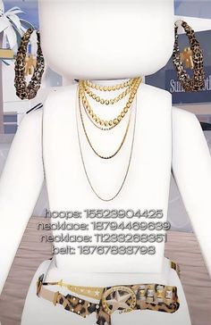 a white mannequin with multiple necklaces and bracelets on it's neck