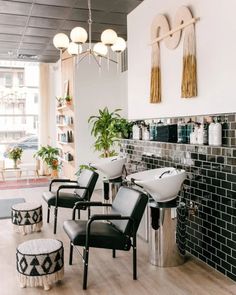 a salon with chairs and sinks in it