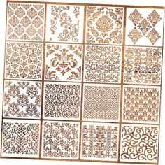 an assortment of decorative stencils in gold and white, with different designs on them