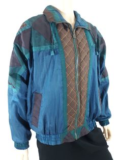 "80's Women's Jacket Geo Colorblock Geometric Blue Green Plum Oversized Bomber Windbreaker Excellent Condition Vintage by ACTIVE STUFF Size M Blue jacket with jewel tones deep green plum purple bronze dark blue geo color block detail with bronze stitching, quilted sections, fully lined in blue, cool front pockets, shoulder pads, oversized, drawstring collar, zipper front with cool zip pull. Very fun piece. Super high quality! This is an exceptional one of these jackets!! Super Nice! In excellent Green Plum, Vintage Bathing Suits, Women's Jacket, Plum Purple, Sleeveless Shirt, Denim Vest, Blue Jacket, Jewel Tones, Deep Green