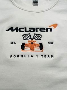 Can remove the Est and year, just mention in comments  Perfect item for that discerning Formula 1 (Formula ONE) racing fan.  Represent the McLaren F1 car when attending your favorite racing event, or anywhere that you'd like to show your support.   I have a listing for Mercedes Racing as well.  Contact me for any other design requests. Can be done in any color that I have in stock for a (6.0 oz) T-shirt, a heavy blend Unisex (8 oz.)    50/50 Fleece sweatshirt, or a (8.0 oz) Hoodie with embroider Cute Formula 1 Outfits, Formula One Clothes, Mclaren Shirt Outfit, F1 Hoodie Design, Formula One Shirt, Gifts For F1 Fans, Formula 1 Shirt Design, Formula 1 Clothes