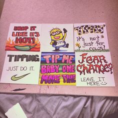 four posters with different sayings on them sitting on a bed next to a pillow