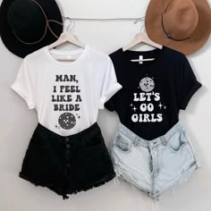 two t - shirts that say man, i feel like a girl and let's go girls