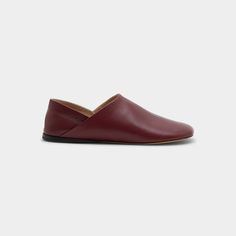 Loewe "Toy" leather slipper loafers Flat heel Round toe Slip-on style Made in Italy Modern Slip-on Moccasins With Leather Lining, Modern Calf Leather Slip-on Moccasins, Modern Slip-on Flats With Stitched Sole, Modern Loafers With Stitched Sole In Calf Leather, Modern Calf Leather Loafers With Stitched Sole, Modern Calf Leather Slip-on Loafers, Leather Slip-on Slippers With Calf Leather Footbed, Modern Slip-on Slippers With Leather Sole, Modern Slip-on Slippers With Textured Sole