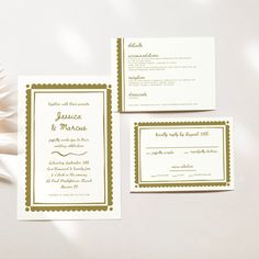 the wedding stationery is laid out on a table