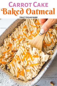 carrot cake baked oatmeal in a baking dish with a wooden spatula