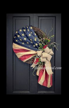 an american flag wreath hanging on the front door