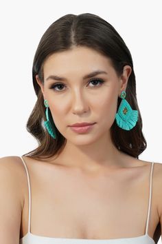 Diamond shape Raffia Earrings Crafted in Aqua Green shade with Golden accents Fringed raffia detailing at the base Pastel, eclectic, summery, and so much fun! This pretty pair of aqua green raffia earrings embellished with delicate gold beads can be teamed up with an off-shoulder top and a pair of palazzos or just a plain tee to give you that perfect summer look. Brighten up any look with these beauties. Take your vacation style quotient up a notch, or add some much-needed refresher to a busy da Turquoise Tassel Earrings For Beach, Summer Turquoise Tassel Drop Earrings, Turquoise Tassel Drop Earrings For Summer, Turquoise Tassel Earrings For Summer, Bohemian Chandelier Earrings For Summer, Turquoise Bohemian Earrings For Spring, Bohemian Turquoise Earrings For Spring, Summer Beach Turquoise Tassel Earrings, Summer Vacation Jewelry With Tassels