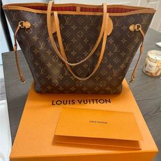 This Purse Was Purchased December 7th 2021. It Is In Good Condition, It Does Have Some Wear And Tear And Water Marks They Are Light. There Are No Stains On The Inside At All. Comes With Original Box And Dust Bag. The Bag Does Have Minor Water Marks On Handles Water Marks, Louis Vuitton Neverfull Mm, Neverfull Mm, Vuitton Neverfull, Louis Vuitton Bags, Louis Vuitton Neverfull, Womens Tote Bags, Louis Vuitton Bag, Original Box