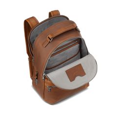 Our flagship leather backpack was designed in Detroit and built to last. This casual and refined piece in smooth Navigator leather includes adjustable padded shoulder straps, a deluxe top carry handle and gunmetal hardware. The cotton-lined interior features dedicated pockets for your laptop and phone. So head into the office, then into the gym and into the weekend without missing a beat. | Shinola Men's Backpack | Brown Leather | Runwell Shinola Detroit, Auburn Brown, Rugged Leather, Mens Leather Bag, Laptop Pocket, Strap Tops, Men's Backpack, Leather Care, Medium Brown