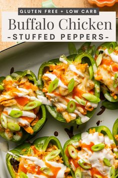 several stuffed peppers with cheese and sauce on top, sitting on a white platter