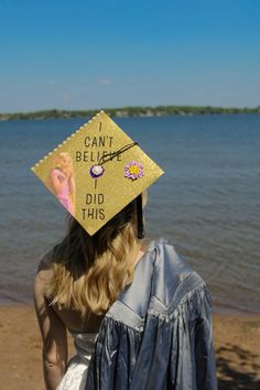 a woman wearing a graduation cap that says i can't believe it did this