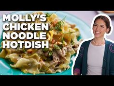 a woman standing in front of a plate of food with the words moly's chicken noodle hot dish