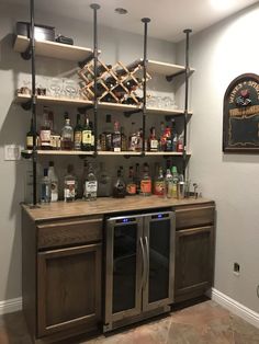 a home bar with liquor bottles on the shelves