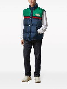 Padded vest by GUCCI in blue and green characterized by logo patch, sleeveless, button closure and drawstring waist. This item is in size 48 and the color is Blue Cotton Gucci Outerwear, Blue Gucci Cotton Outerwear, Gucci Casual Cotton Outerwear, Gucci Outerwear With Pockets For Streetwear, Casual Gucci Cotton Outerwear, Gucci Cotton Outerwear With Pockets, Gucci Sporty Streetwear Outerwear, Gucci Sporty Outerwear For Streetwear, Sporty Gucci Outerwear For Streetwear