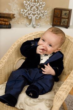 "A gentleman suit with elegant frock-coat, in an ivory and lovely navy blue combination, is such a perfect choice for little boys, who later will become handsome men. The details make from this \"Grandma's chest\" Collection occasion suit a real heirloom. Please measure the little one prior to ordering, to be sure the suit fits him. The measurements that you need to take are. Height Chest Circumference Waist Circumference Hips Circumference Suit components: trousers with belt, shirt with bow and velvet frock-coat. Colors: ivory and navy blue. Composition: cotton/rayon velvet and shantung silk. Please check our SIZE CHART and cleaning instructions at \"Policies\" section!" Blue Tuxedo Style Three-piece Suit For Wedding, Classic Royal Blue Wedding Suits, Royal Blue Tuxedo Suit For Wedding, Elegant Blue Three-piece Suit For Wedding, Bespoke Blue Wedding Tuxedo, Elegant Blue Three-piece Suit, Blue Elegant Formal Sets, Elegant Blue Formal Sets, Bespoke Blue Tuxedo