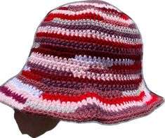 a crocheted hat with red, white and blue stripes on the brim