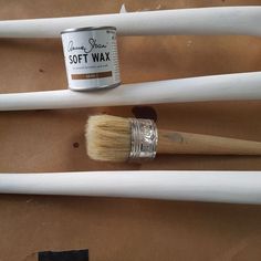 two paint brushes sitting next to each other