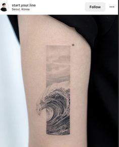 a woman's arm with a wave tattoo on the left side of her body