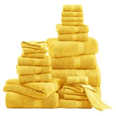 a stack of yellow towels sitting next to each other