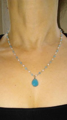 The gemstone Angelite is reminiscent of the sea off Peru where it is found; the sumptuous blue is naturally soothing. Combined with delicate pearls which symbolize serenity, this necklace evokes the beauty of the sea. The necklace is delicate but has a presence due to the generous size of pendent gemstone. Elegant Turquoise Crystal Necklaces For Jewelry Making, Elegant Blue Pendant Crystal Necklaces, Elegant Single Strand Pendant Crystal Necklace, Elegant Blue Pendant Crystal Necklace, Elegant Blue Crystal Pendant Necklace, Elegant Blue Drop Necklaces, Elegant Turquoise Gemstone Crystal Necklace, Elegant Turquoise Gemstone Beaded Necklace, Turquoise Necklace With Pearl Drop As Gift