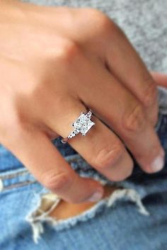 a close up of a person wearing a ring