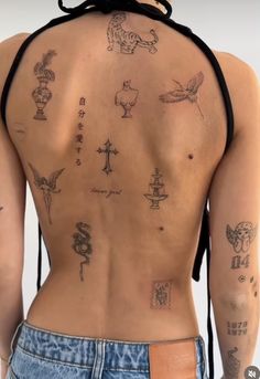 the back of a woman with tattoos on her body