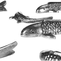 several metal fish shaped objects flying in the air