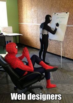 there is a spider man sitting in an office chair writing on a whiteboard with his hands