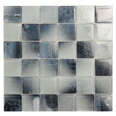 a close up view of a glass mosaic tile wall with gray and white squares on it