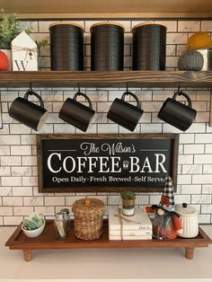 a coffee bar with cups hanging on the wall