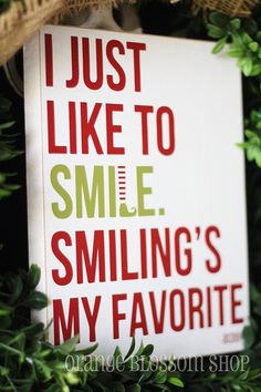 a sign that says, just like to smile smiling's my favorite on it