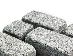 four black and white rocks sitting on top of each other