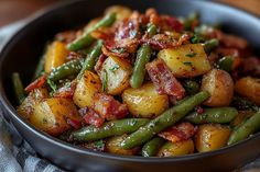 a bowl filled with potatoes and green beans