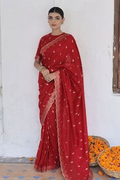 Red saree crafted in moonga silk with gold toned mughal flora vine woven detail along the scallop border and damask butti detail. Paired with a matching half sleeves closed round neck blouse. - Aza Fashions Saree With Unstitched Blouse For Eid Rituals, Unstitched Banarasi Silk Blouse For Rituals, Eid Traditional Wear With Unstitched Blouse, Semi-stitched Saree With Unstitched Blouse For Rituals, Festive Anarkali Blouse For Rituals, Pre-draped Cutdana Saree For Rituals, Festive Zari Work Blouse Piece For Rituals, Unstitched Silk Traditional Wear For Rituals, Elegant Art Silk Dupatta For Rituals