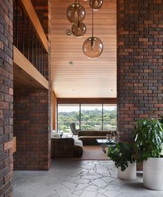 a living room filled with furniture and lots of windows