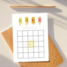 a greeting card with popsicles and the word baby on it next to a pencil