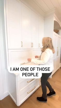 a woman standing in front of a kitchen counter with the words i am one of those people