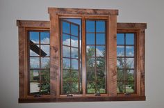 an open window with wooden frame and glass panes