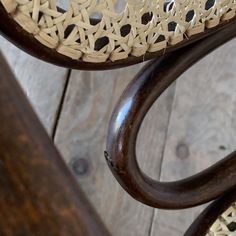 an upholstered wooden chair with intricate carvings on the back