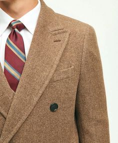 We crafted our striking coat from Italian-woven wool in a classic herringbone pattern that gives a stately impression. Double-faced for durability and weather protection, boasting an elevated butterfly lining for comfort, this is a must-have piece for any outerwear wardrobe. Additional features include peak lapels and oversized front pockets..75% Wool, 25% Polyamide.Dry Clean.Imported.We crafted our striking coat from Italian-woven wool in a classic herringbone pattern that gives a stately impre Classic Winter Sweater Coat With Lapel Collar, Classic Single-breasted Winter Sweater Coat, Classic Single-breasted Sweater Coat For Winter, Classic Double-breasted Tweed Outerwear, Winter Double-breasted Tweed Jacket For Tailoring, Classic Brown Sweater Coat For Winter, Business Wool Coat With Herringbone Pattern, Brown Double-breasted Tweed Jacket For Winter, Tailored Outerwear With Lapel Collar And Herringbone Pattern