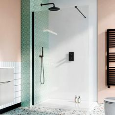 a bath room with a toilet and a stand up shower next to a wall mounted radiator