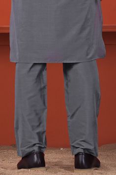 Discover understated sophistication with our Fuscous Gray Subtle Sheen Viscose Pajama. This ensemble exudes timeless elegance, offering both comfort and style in one. Elevate your fashion quotient with this versatile outfit. If you're an enthusiast of ethnic items, grab this amazing piece now before it goes out of stock! Pajama Fabric: 100 % Premium Viscose Double reinforced front, back and side seams. Durable broad waistband with Concealed Strings. Thoughtful Construction. Two Pockets. One with Traditional Workwear Sets With Straight Pants, Traditional Formal Sets With Straight Pants, Elegant Pants For Eid Workwear, Elegant Straight Pant Set For Eid, Elegant Straight Pants Set For Eid, Elegant Pant Set For Workwear And Eid, Elegant Fitted Lawn Suit For Workwear, Elegant Full-length Sets For Eid, Elegant Full Length Sets For Eid