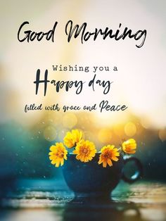 a blue vase filled with yellow flowers and the words good morning wishing you a happy day