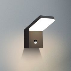 a light that is on the side of a wall with a white light in it